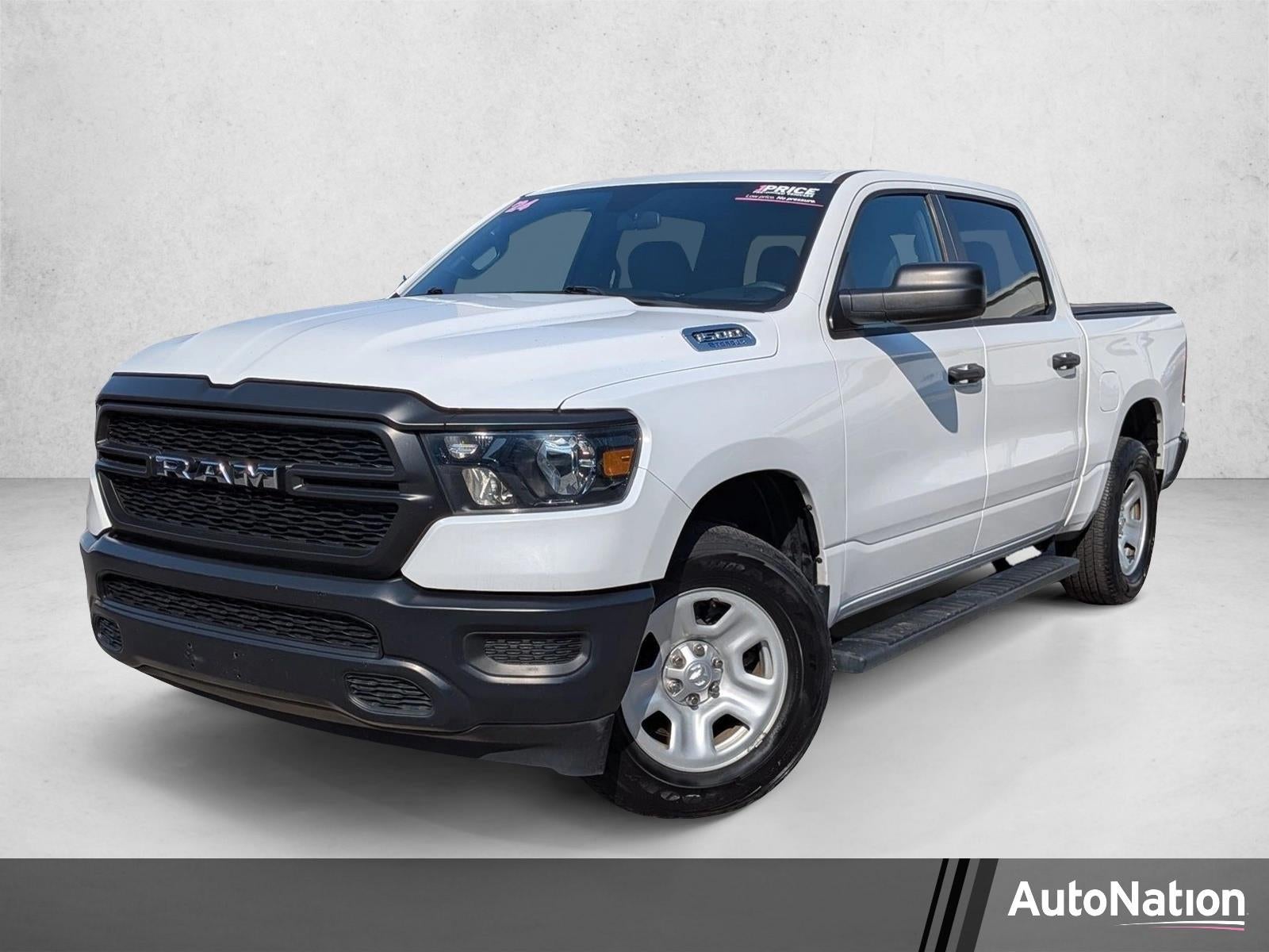 2024 RAM 1500 Tradesman 4x4 Crew Cab 5'7" Box in Bright White Clearcoat — front three-quarter view