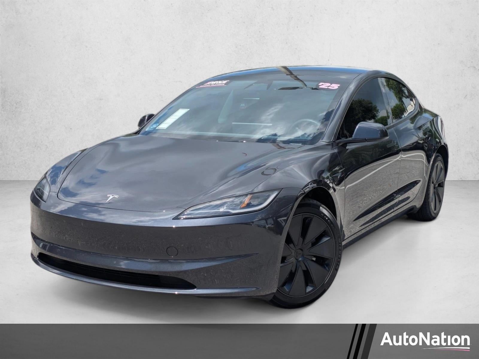 2025 Tesla Model 3 Long Range RWD in Stealth Grey — front three-quarter view