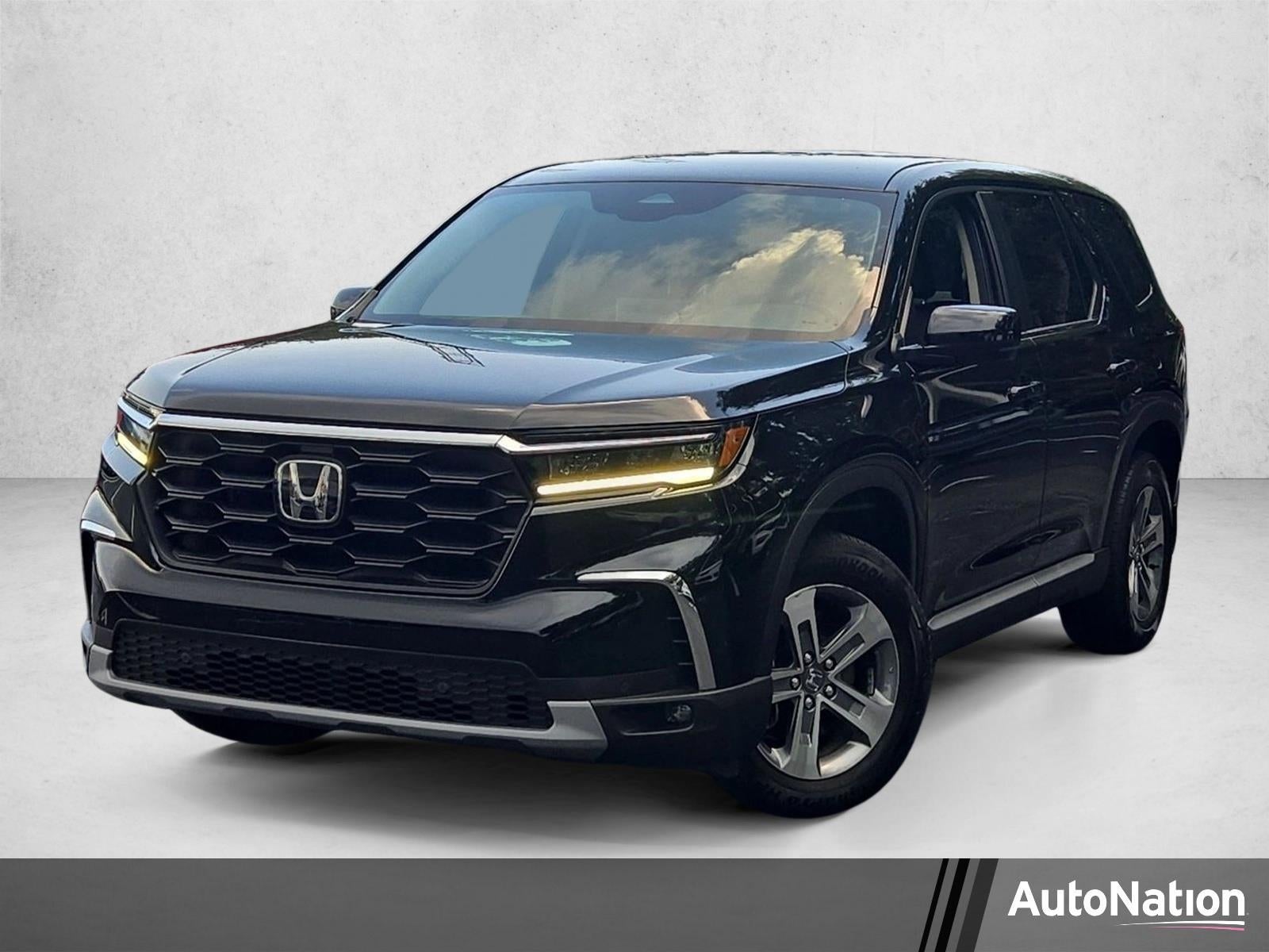 2024 Honda Pilot EX-L 7 Passenger 2WD in Crystal Black Pearl — front three-quarter view