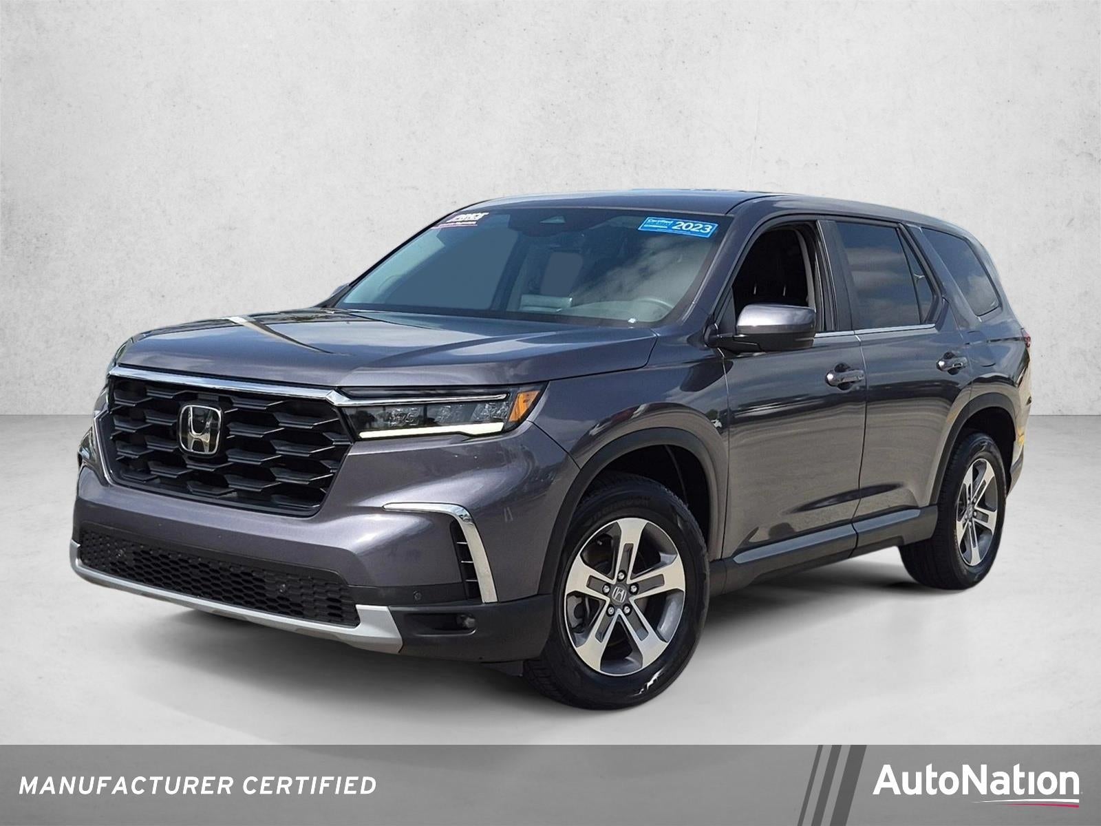 2023 Honda Pilot EX-L 7 Passenger 2WD in Modern Steel Metallic — front three-quarter view