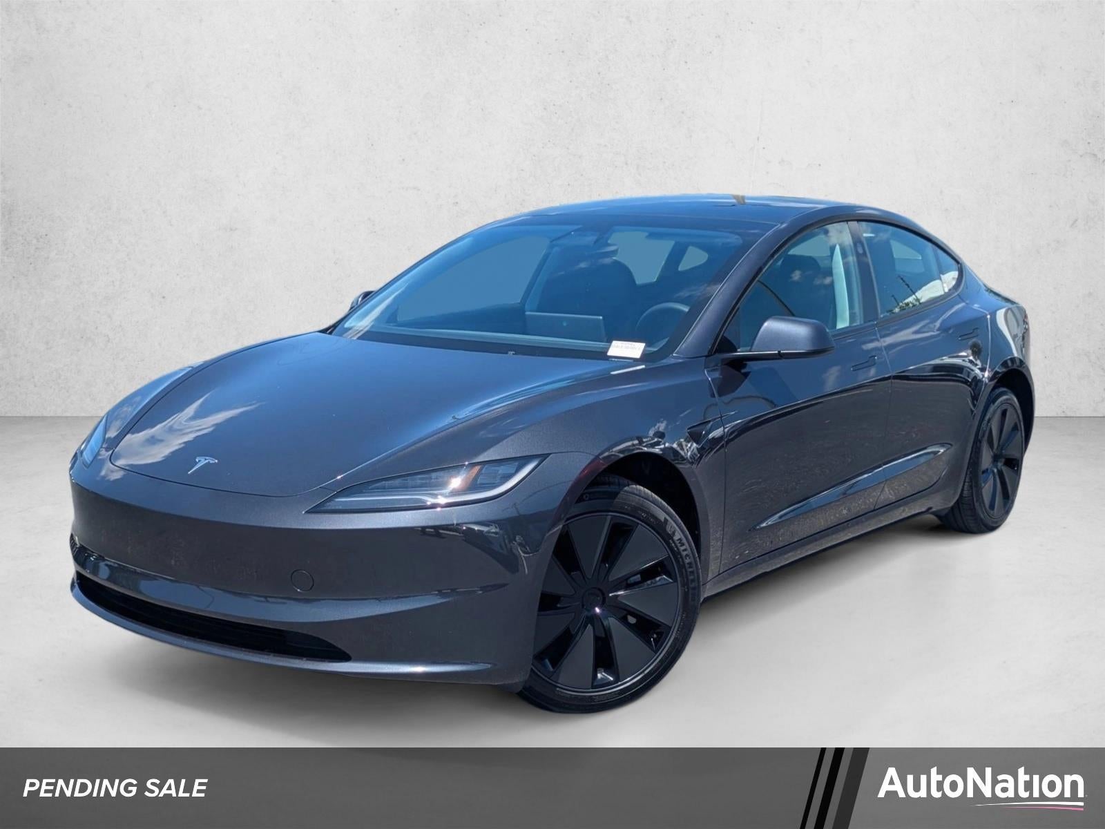 2025 Tesla Model 3 Long Range RWD in Stealth Grey — front three-quarter view