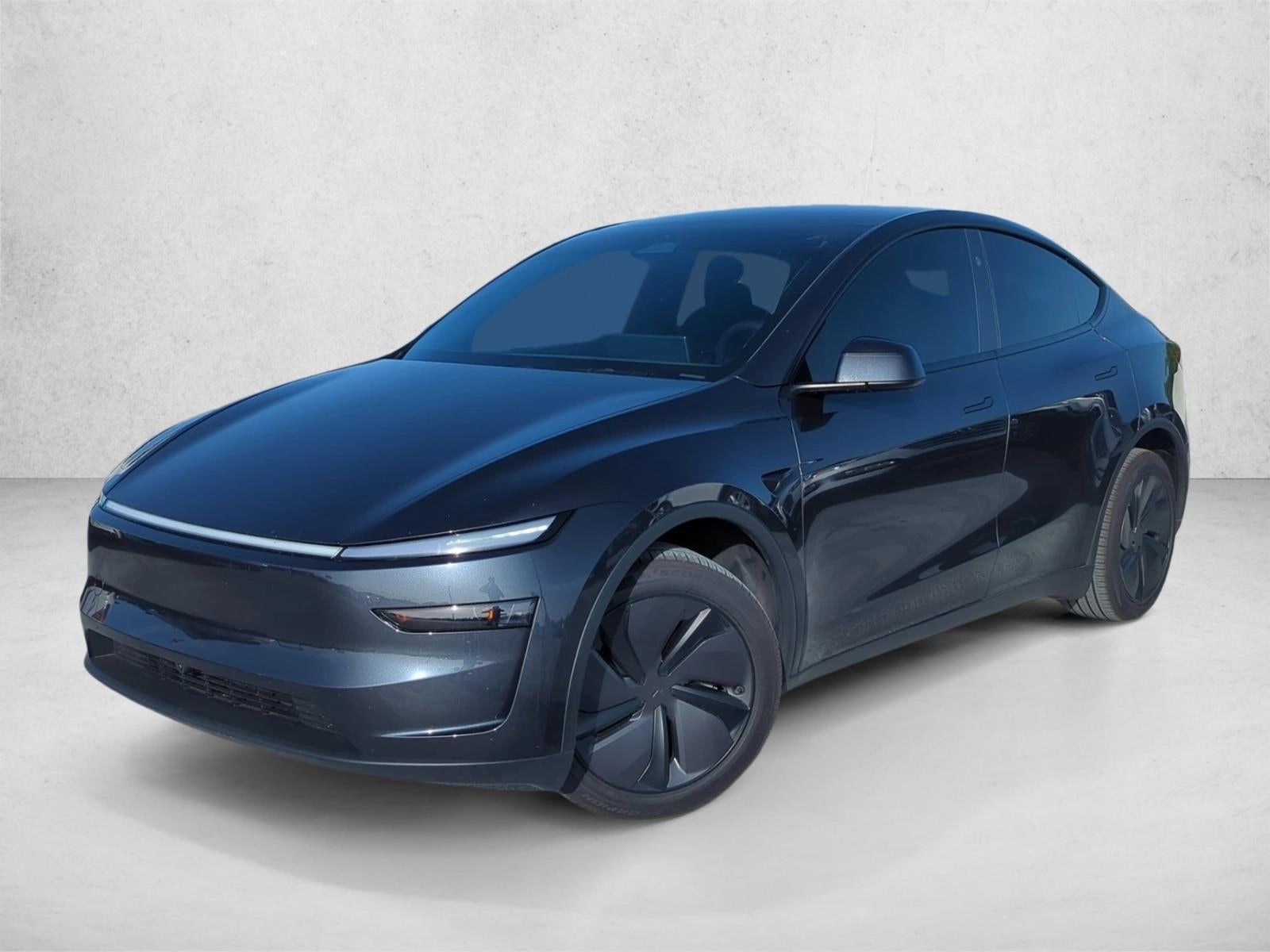 2026 Tesla Model Y Premium RWD in Gray — front three-quarter view