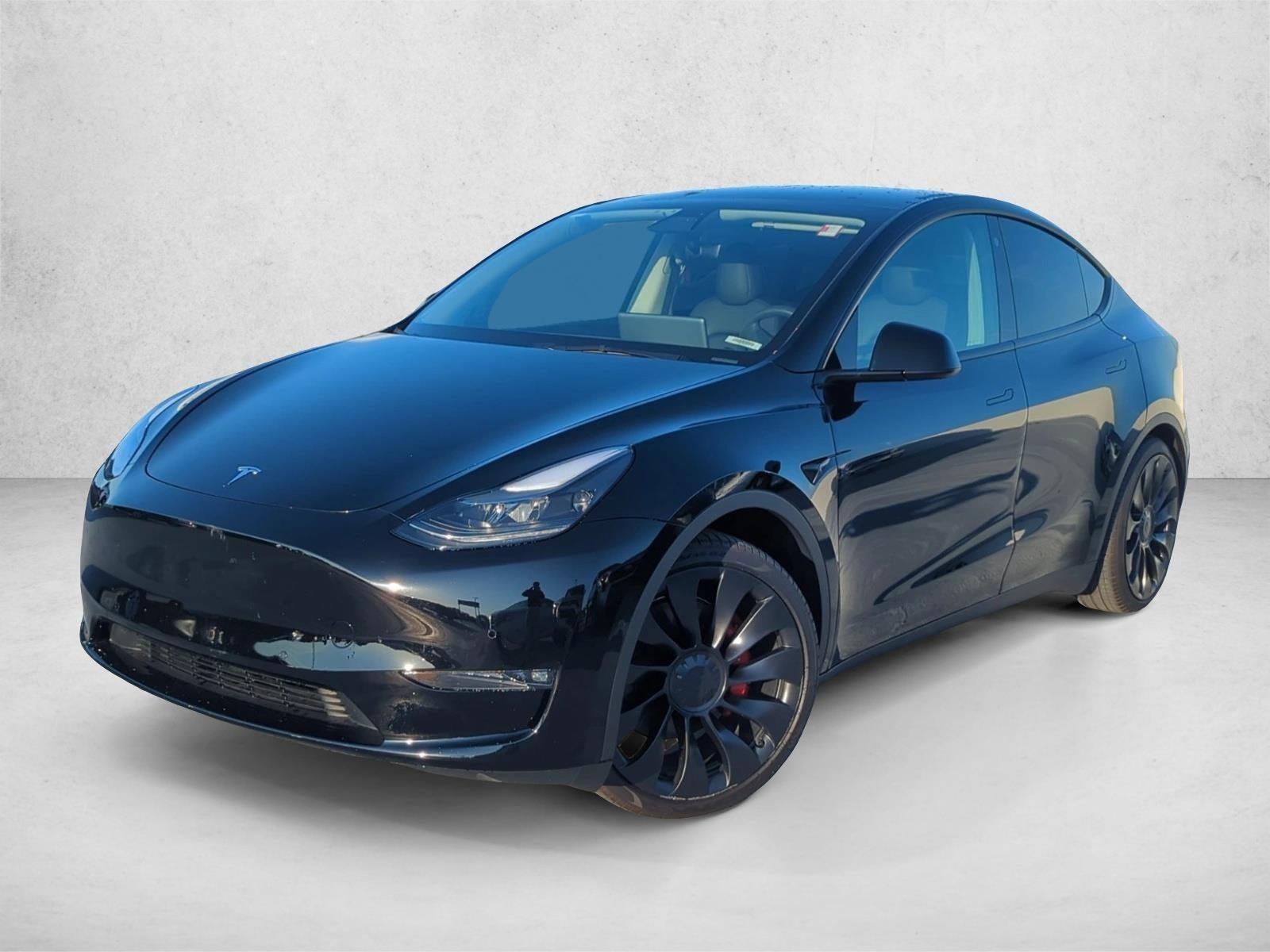 2022 Tesla Model Y Performance AWD in Solid Black — front three-quarter view