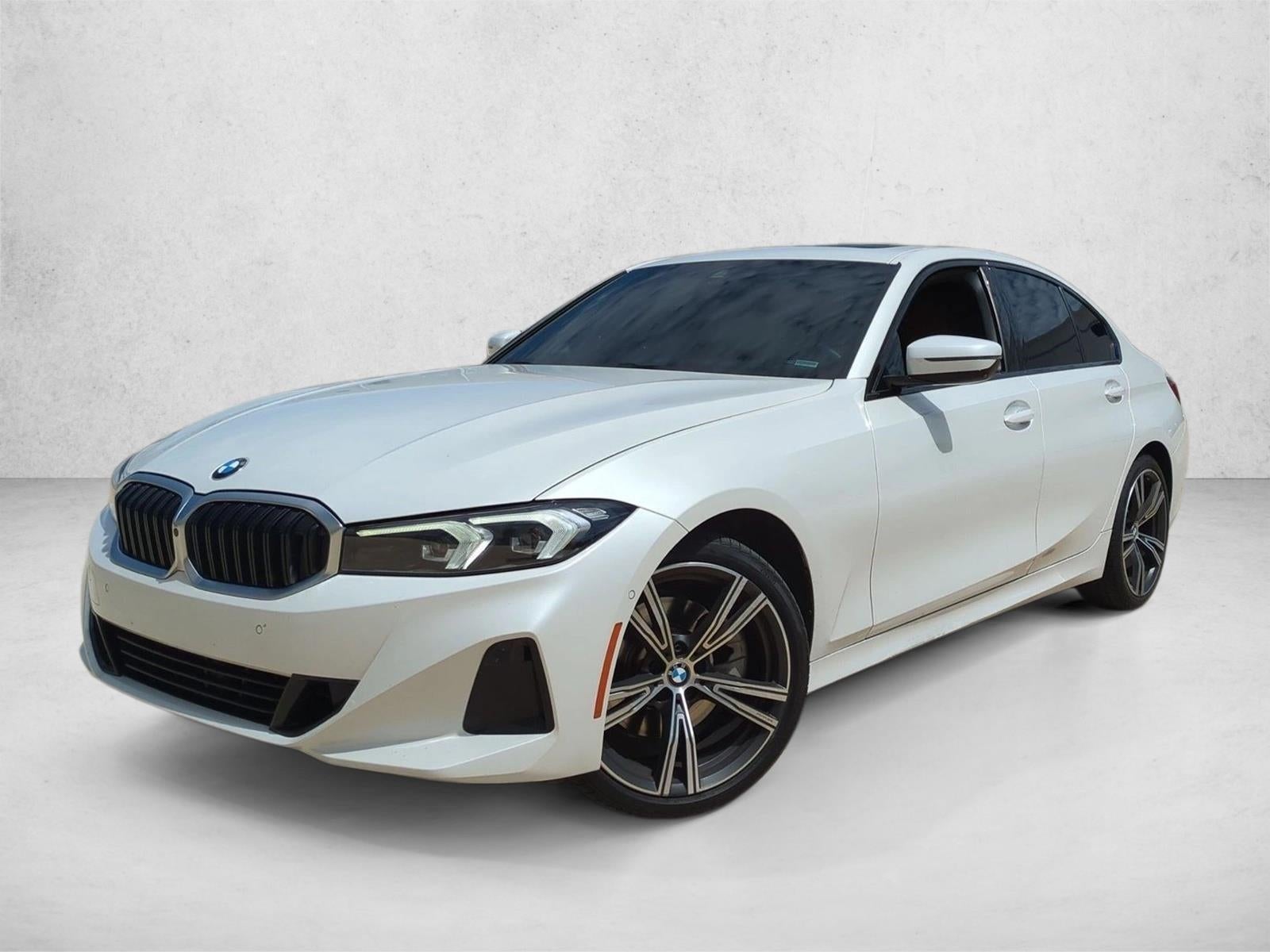 2023 BMW 330i Sedan in Alpine White — front three-quarter view