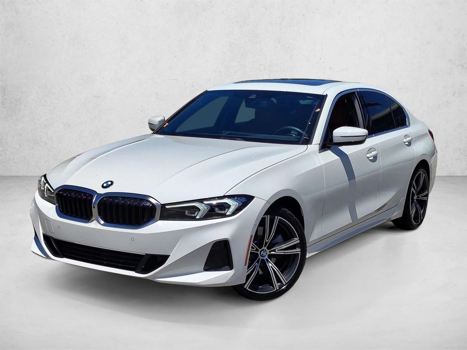 2024 BMW 330i Sedan in Alpine White — front three-quarter view