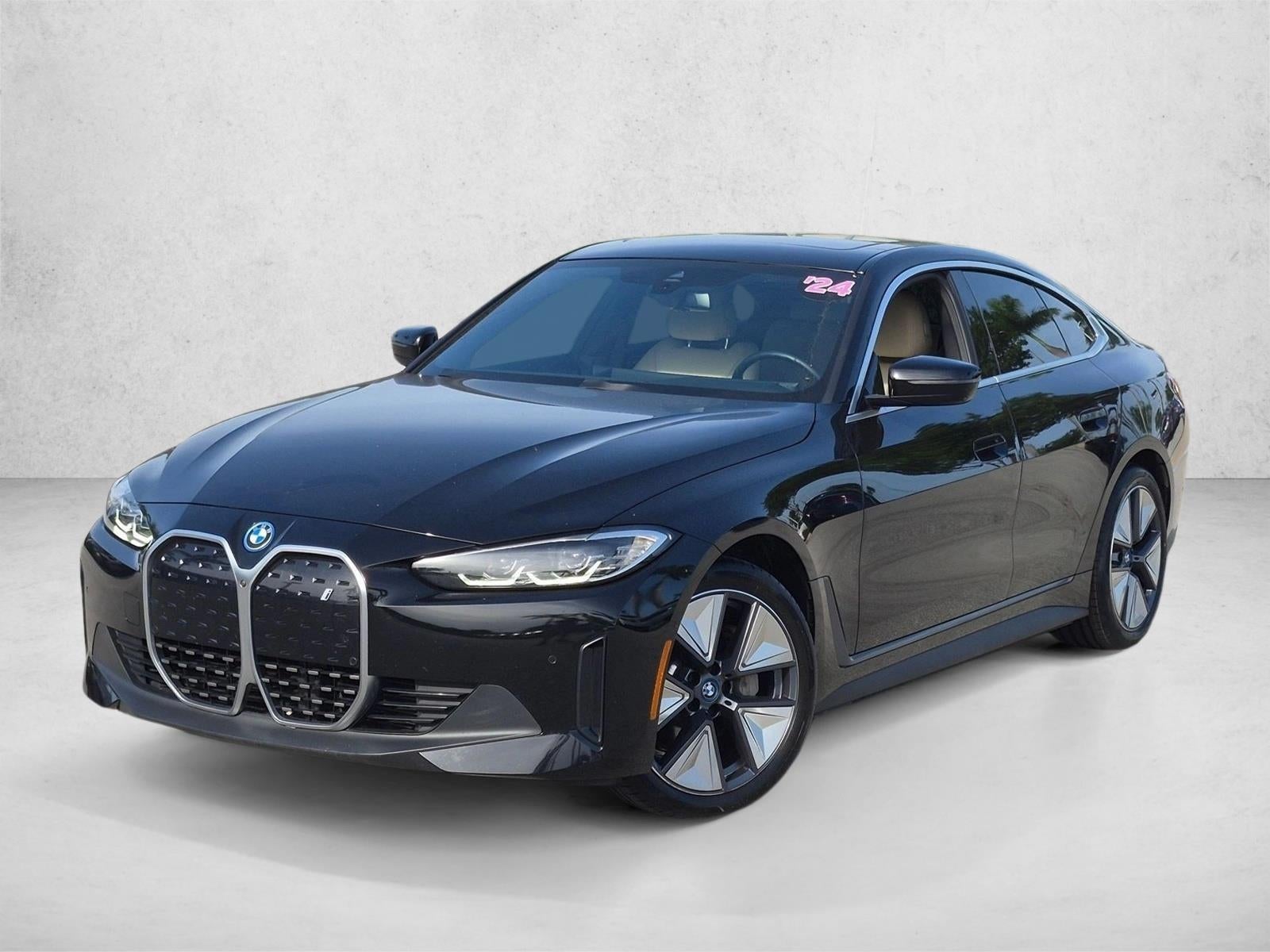 2024 BMW i4 Gran Coupe in Jet Black — front three-quarter view