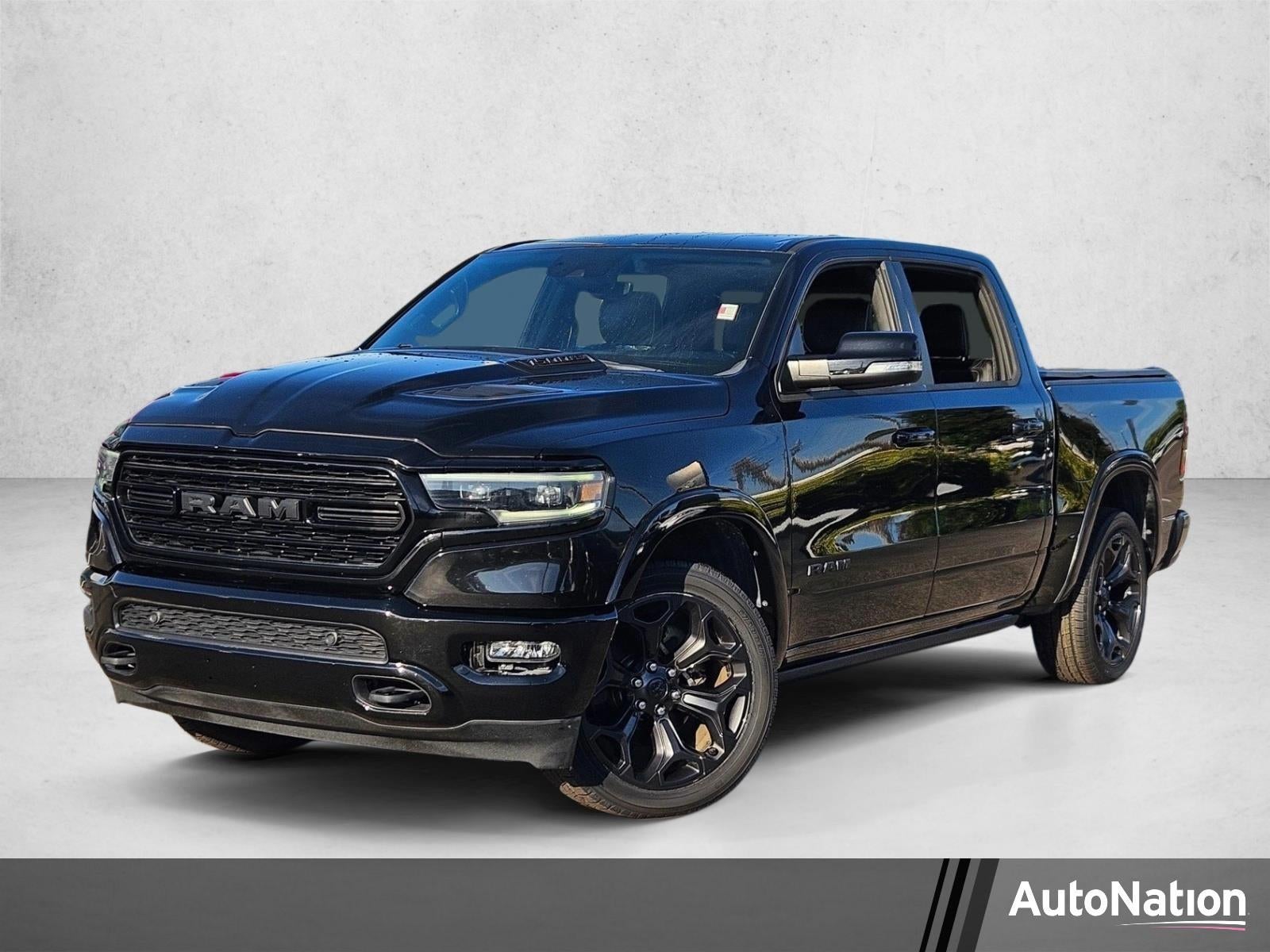 2021 RAM 1500 Limited 4x4 Crew Cab 5'7" Box in Diamond Black Crystal Pearlcoat — front three-quarter view
